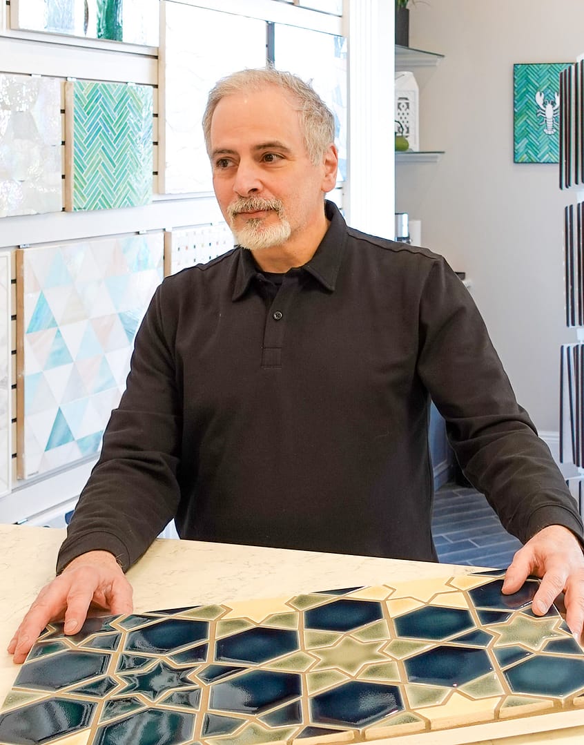 Tile By Design owner Joe Renda reviews tile for contracors in their Danvers, MA tile showroom.